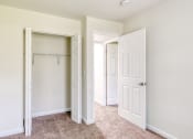 Thumbnail 8 of 36 - an empty bedroom with white doors and a closet
