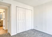 Thumbnail 20 of 56 - A white door with a grey carpet in front of it.