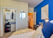 Thumbnail 38 of 60 - a bedroom with a bed and a closet at Proximity at ODU, Virginia, 23508