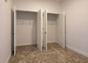Thumbnail 9 of 29 - A room with two open closets at Aviator Lofts, Newport News, VA 23602