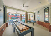 Thumbnail 10 of 55 - Game Room With Shuffle Board at The Lincoln Apartments, Raleigh