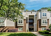 Thumbnail 66 of 67 - A modern apartment building with a mix of brick and siding exteriors.
