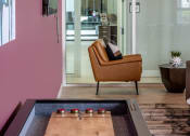 Thumbnail 8 of 47 - Enjoy a game of shuffleboard at the Resident Lounge and Social Space Centro at Pine Nash, Wilson, NC