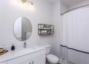 Thumbnail 38 of 47 - Featured model bathroom with tub and vanity Centro at Pine Nash, Wilson, NC