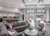 Thumbnail 5 of 47 - Resident Lounge and Social Space with pool deck access Centro at Pine Nash, Wilson, NC
