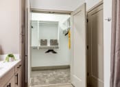 Thumbnail 13 of 38 - a bathroom with a shower and a sink and a mirror at Aura Stonebridge, Richmond Virginia