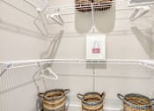 Thumbnail 4 of 35 - Three baskets are hanging on a wire rack.
