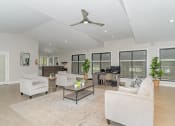 Thumbnail 23 of 43 - a living room with white furniture and a ceiling fan at Village 1373, North Carolina, 27455