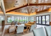 Thumbnail 75 of 81 - a lobby with couches chairs and tables and windows at Ainsworth, Richmond, Virginia