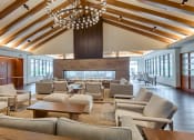 Thumbnail 1 of 81 - a large living room with couches and chairs and a fireplace at Ainsworth, Virginia