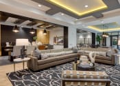 Thumbnail 20 of 38 - a large living room with couches and tables at Aura Stonebridge, Virginia, 23225