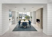 Thumbnail 10 of 42 - A dining room with a table set for six.