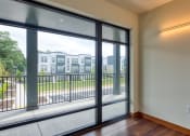Thumbnail 14 of 81 - a living room with large windows and a balcony at Ainsworth, Virginia, 23228