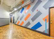 Thumbnail 34 of 46 - a geometric wall mural in a hallway at The Hudson, Richmond, Virginia