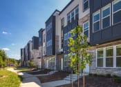 Thumbnail 16 of 81 - a row of apartment buildings on a sunny day at Ainsworth, Richmond, 23228