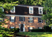 Thumbnail 34 of 39 - Exterior of Colonial Towne Apartments with trees