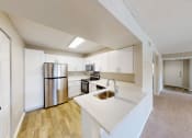 Thumbnail 38 of 40 - a kitchen with white cabinets and stainless steel appliances