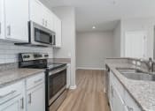 Thumbnail 1 of 27 - Fully Furnished Kitchen at The Greens at Fort Mill, South Carolina
