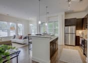 Thumbnail 27 of 55 - Kitchen Island With Pendent Lights at The Lincoln Apartments, Raleigh, NC