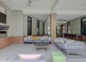 Thumbnail 12 of 55 - Outdoor Lounge With TV at The Lincoln Apartments, Raleigh, 27601