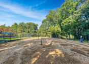 Thumbnail 10 of 44 - Dog Park View at Wendover River Oaks Apartments, Greensboro, NC, 27409