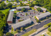 Thumbnail 21 of 22 - an aerial view of a parking lot and buildings