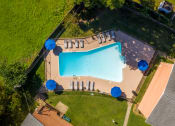 Thumbnail 16 of 22 - arial view of a pool in a backyard with umbrellas