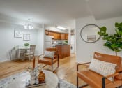 Thumbnail 5 of 22 - an open living room with a dining room and a kitchen