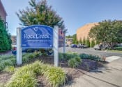 Thumbnail 17 of 22 - the rock creek sign at the entrance apartments