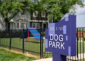 Thumbnail 28 of 31 - A sign that says Dublin Park Dog Park in front of a house.