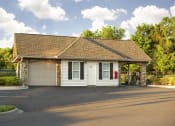 Thumbnail 54 of 56 - a white garage with a white door and a brown roof
