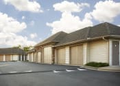 Thumbnail 53 of 56 - a row of garages in a parking lot