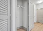 Thumbnail 45 of 59 - A white door is open to a hallway.