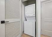 Thumbnail 41 of 59 - A white dishwasher is placed in a small kitchen.