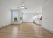Thumbnail 35 of 59 - A room with wooden floors and a ceiling fan.