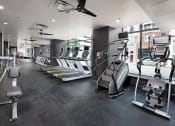 Thumbnail 19 of 46 - a view of a fitness room with treadmills and other exercise equipment