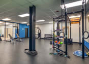 Thumbnail 42 of 46 - a workout room with weights and other exercise equipment  at The Hudson, Richmond, Virginia