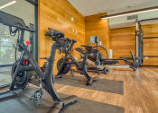 Thumbnail 7 of 81 - a gym with three exercise bikes in the lobby of a building at Ainsworth, Virginia, 23228
