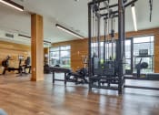 Thumbnail 64 of 81 - a gym with weights and other exercise equipment on a wooden floor at Ainsworth, Virginia