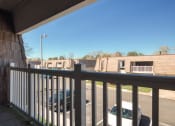 Thumbnail 52 of 52 - a view from the balcony of a building with a car in the parking lot  at Bayville Apartments, Virginia Beach, VA, 23455