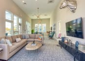 Thumbnail 19 of 53 - a living room with a couch and a tableat Blue Ridge Commons Apartments, Roanoke, 24017