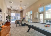 Thumbnail 17 of 53 - a community room with a pool table and a large windowat Blue Ridge Commons Apartments, Roanoke, 24017