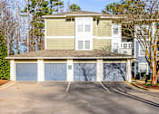 Thumbnail 11 of 20 - A two-story house with a garage.