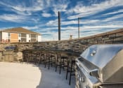 Thumbnail 13 of 53 - a patio with tables and chairs and a barbecue grillat The View at Blue Ridge Commons Apartments, Roanoke, 24017
