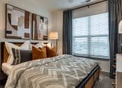 Thumbnail 9 of 38 - an example of a bedroom with a bed and a window at Aura Stonebridge, Richmond, VA 23225