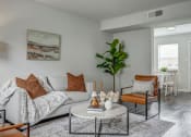 Thumbnail 5 of 32 - a living room with a couch and a coffee table