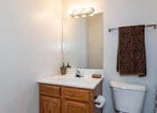 Thumbnail 20 of 22 - A white sink with a brown towel hanging on the wall.