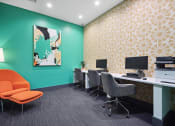Thumbnail 9 of 57 - a office with a green wall and orange chairs and desks at Shellbrook, Raleigh, North Carolina
