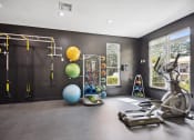 Thumbnail 16 of 57 - a home gym with exercise equipment and a window at Shellbrook, Raleigh, 27609