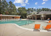 Thumbnail 11 of 57 - our apartments have a large swimming pool with orange chairs at Shellbrook, Raleigh, North Carolina